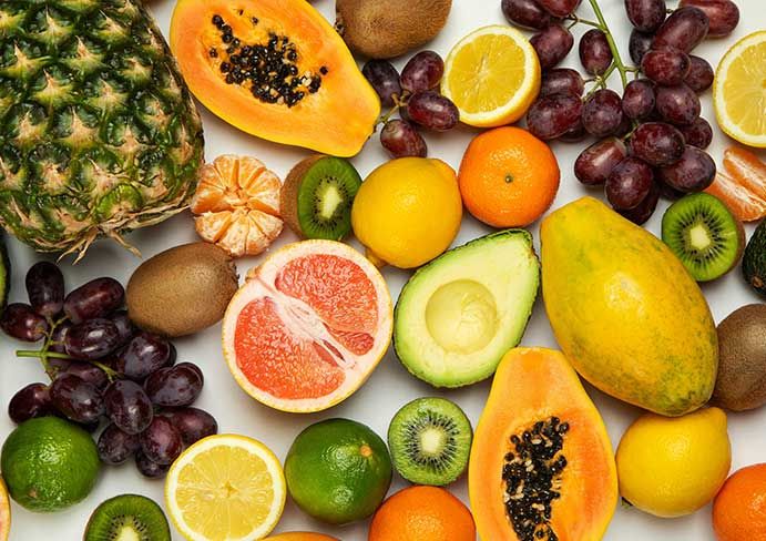  various colorful fruits spread out on the table