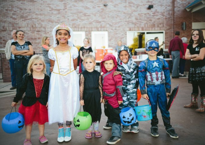 Children in costumes posing for a photo